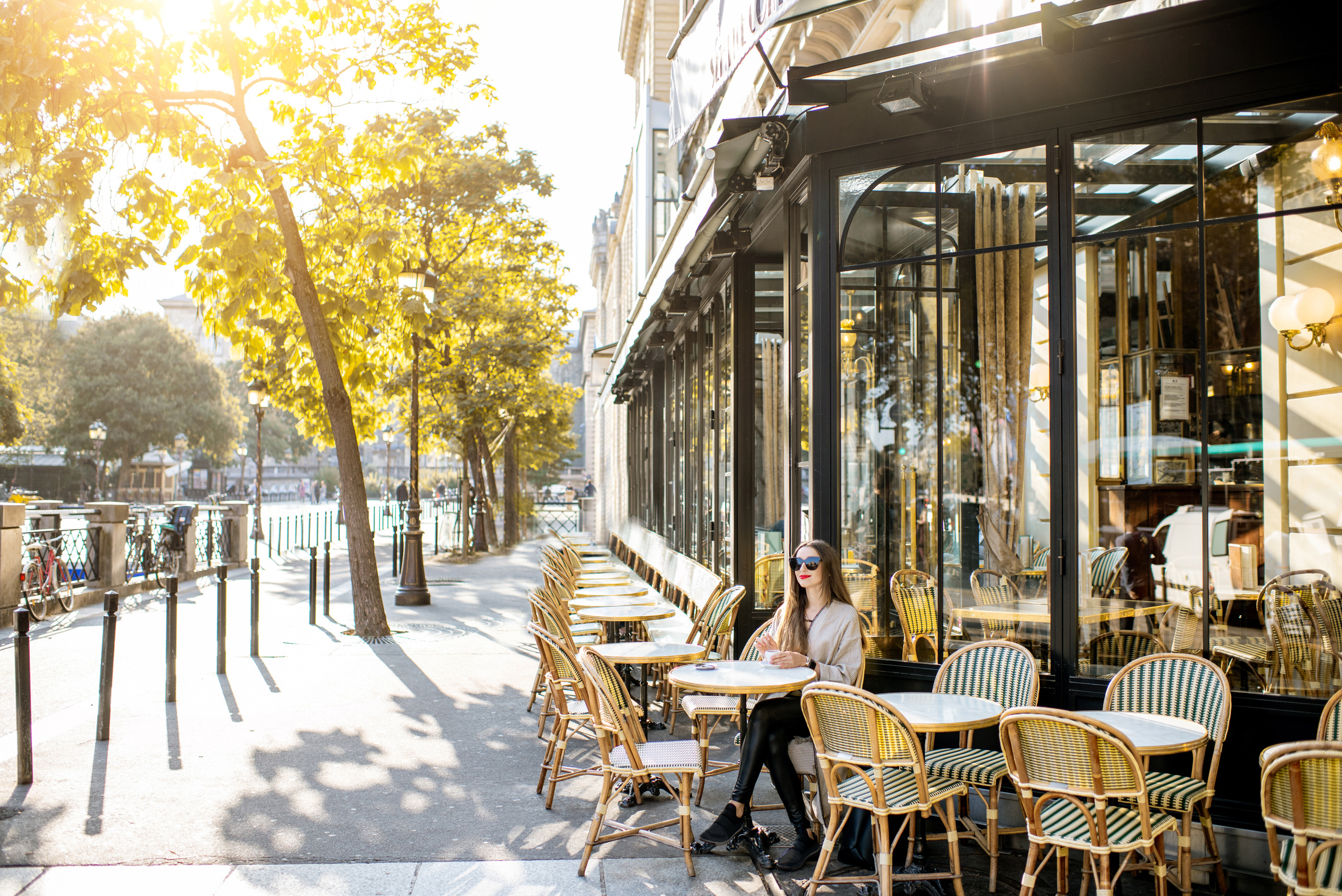 Woman Sitting Outdoors at the French Cafe